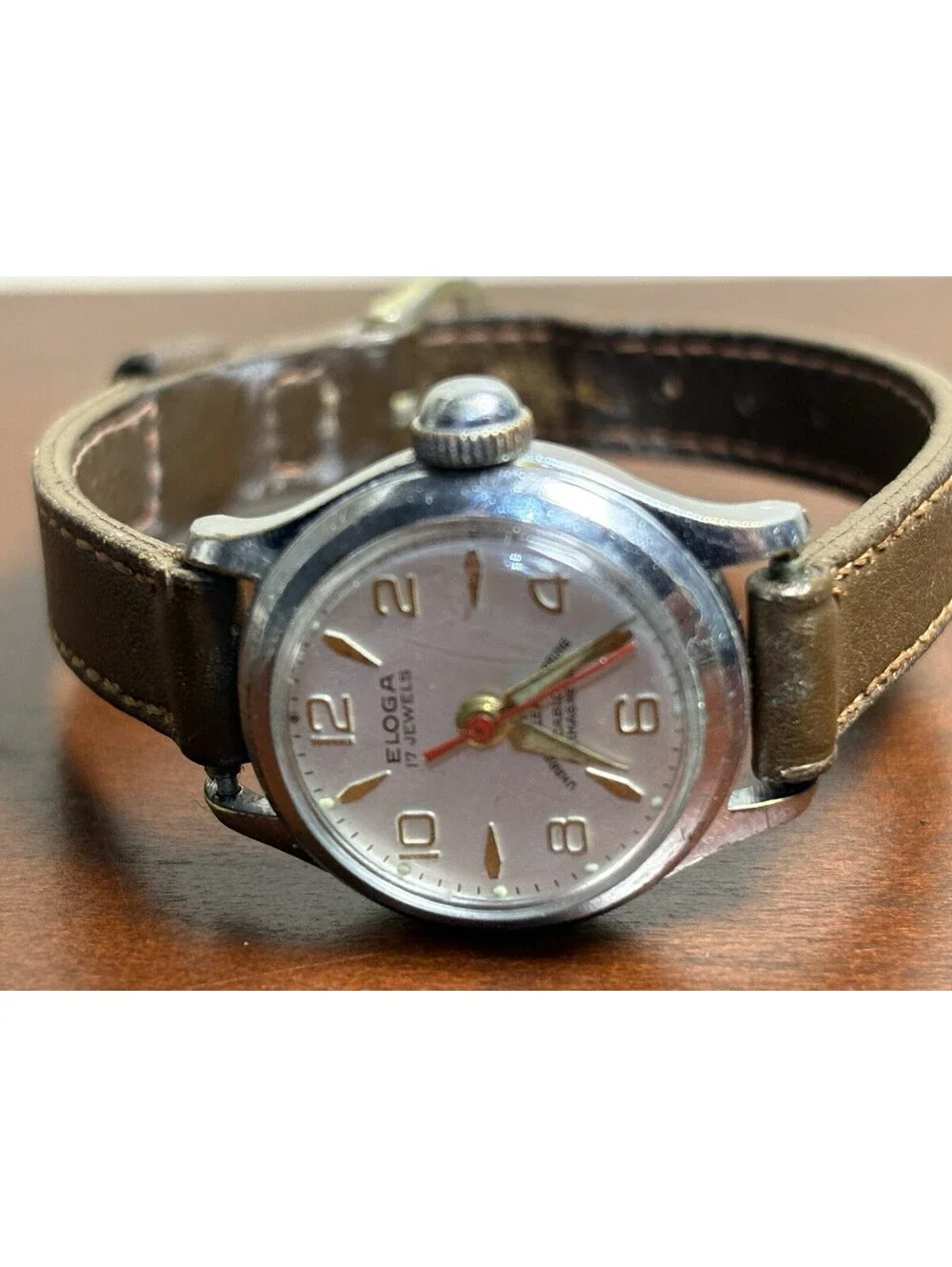 Vintage Eloga 17J Hand-Wind Watch Red Second Hand Cream Dial Explorer Font Swiss
